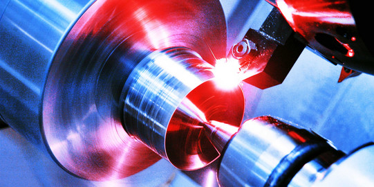 Close-up of a machine for manufacturing in blue tones.
